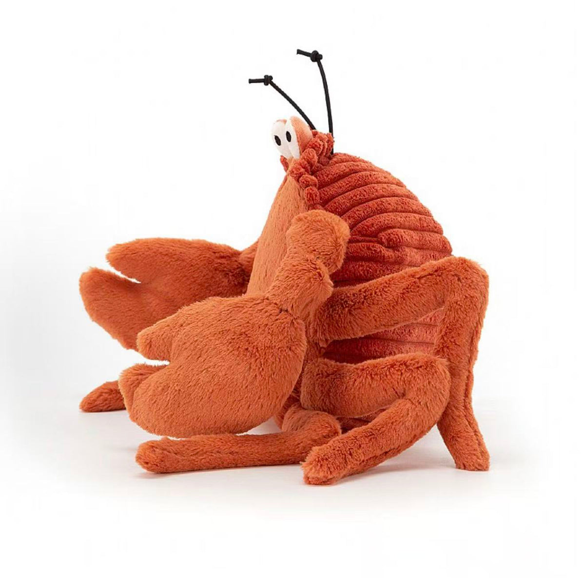 Jellycat Crispin Crab 15cm orange plush, side view with claws and antennae