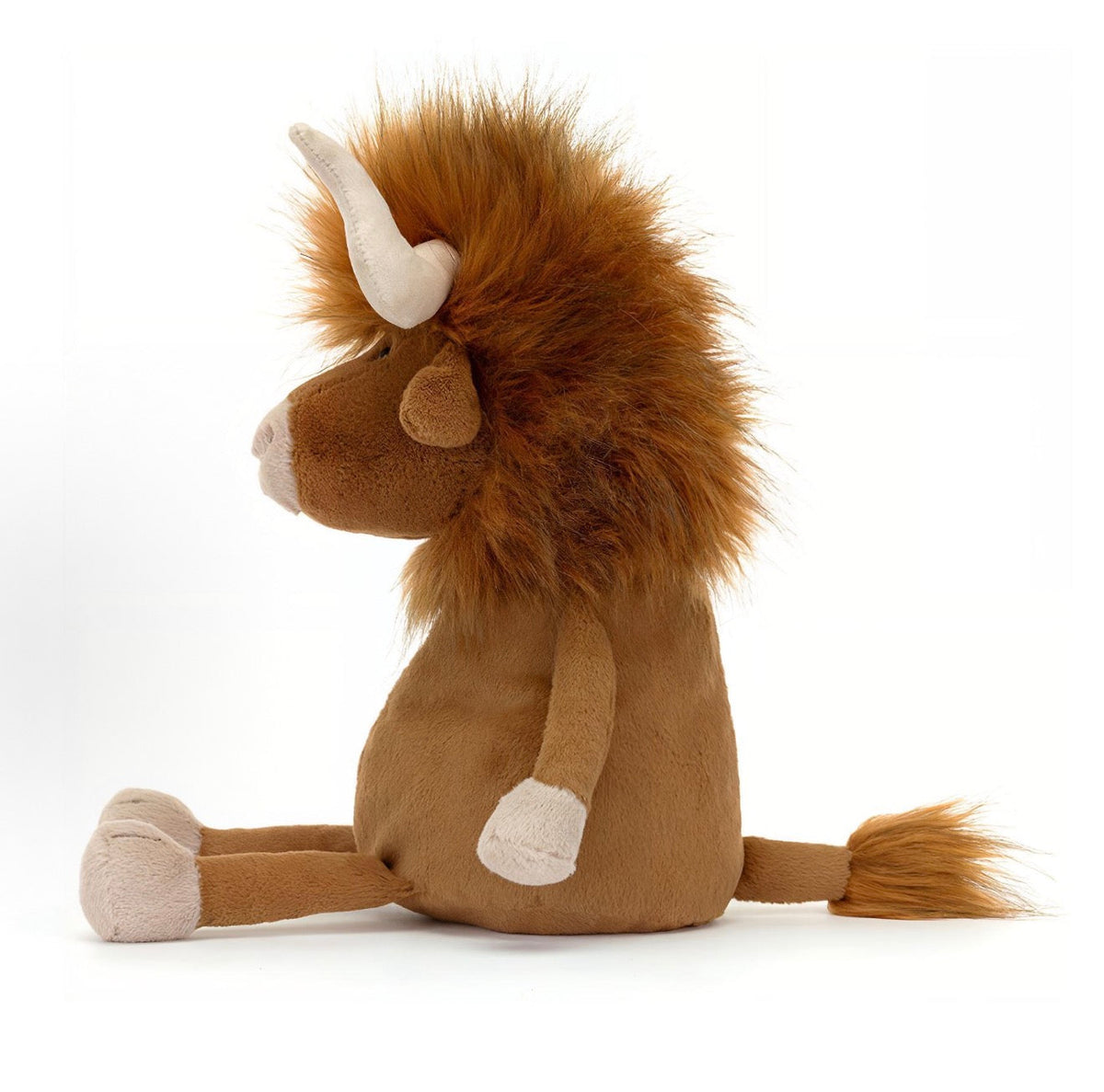 Side view of Jellycat Ramone Bull showing shaggy mane, cream horn and tufted tail