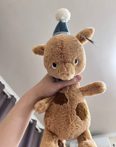 Jellycat Jollipop Giraffe 23cm plush with blue party hat, close-up view